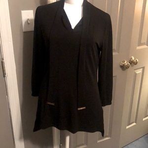 MK blouse with ties. Full sleeve with elastic at the wrist.